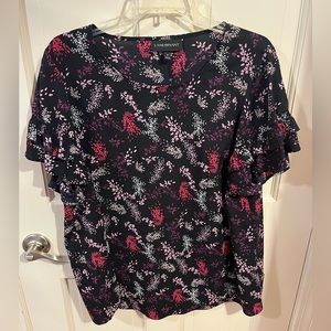 Purple and pink floral, ruffled short sleeve blouse.